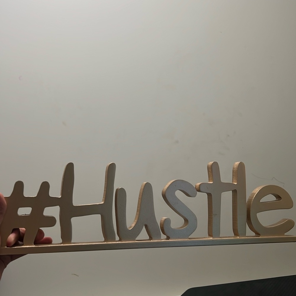 Gold #Hustle sign